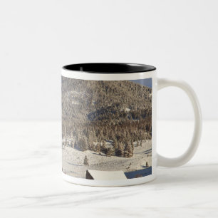 Wooden barn sits in snow near the Boulder Two-Tone Coffee Mug