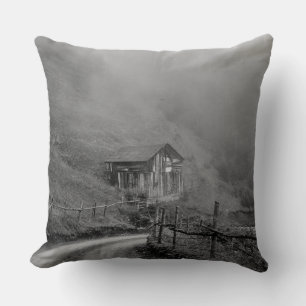 Wooden hut in nature/fog at mountain cushion