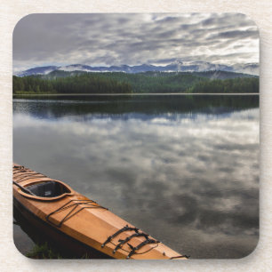 Wooden kayak on shore of Beaver Lake Coaster