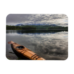 Wooden kayak on shore of Beaver Lake Magnet