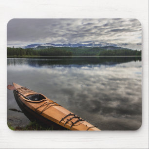 Wooden kayak on shore of Beaver Lake Mouse Pad