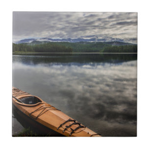 Wooden kayak on shore of Beaver Lake Tile