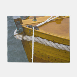Wooden Sailboat In Water Doormat