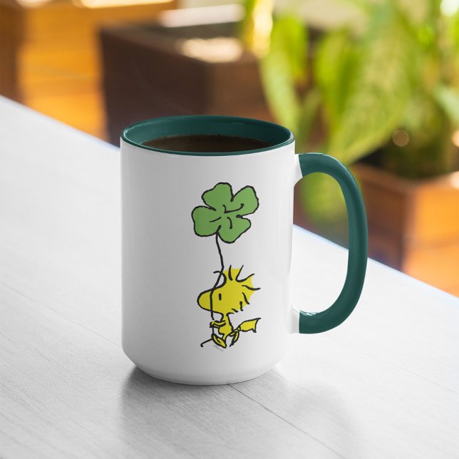 Woodstock Carrying Shamrock Mug (Mug on table)