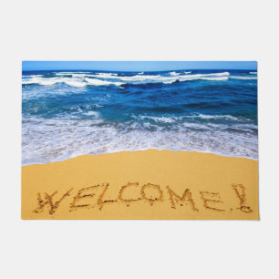 Word WELCOME! Written on Sandy Beach Doormat