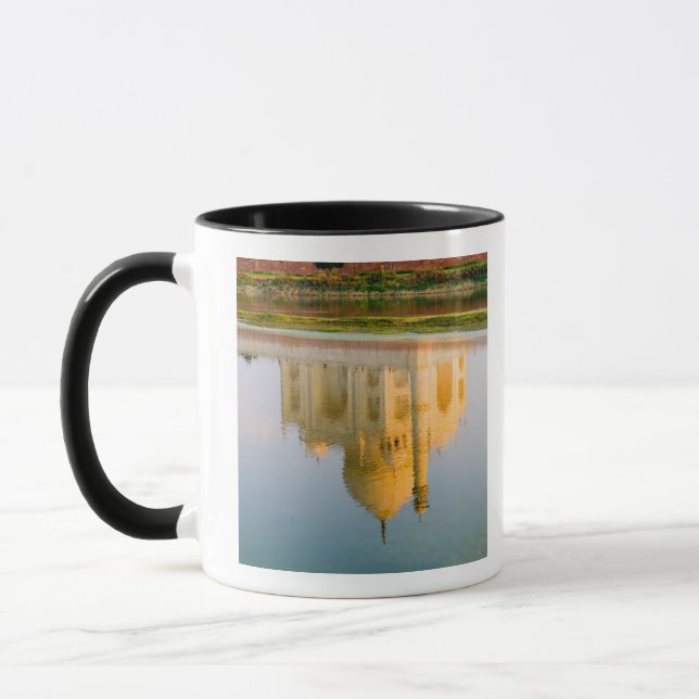 World famous Taj Mahal temple reflection at Mug (Left)