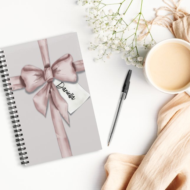 Wrapped in a pink bow notebook (Creator Uploaded)