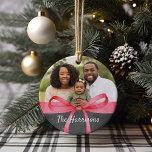 Wrapped in Red | Photo Christmas Ceramic Ornament<br><div class="desc">Festive holiday photo ornament features a favorite image on each side,  adorned with a red watercolor ribbon bow illustration. Your custom caption appears beneath in white lettering on a rustic chalkboard background. Shown with your family name on one side and the year on the other.</div>