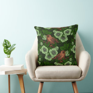 Wren and hellebore on dark green cushion