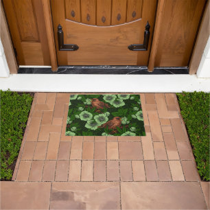 Wren and hellebore on dark green doormat
