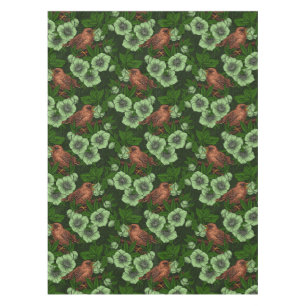 Wren and hellebore on dark green tablecloth