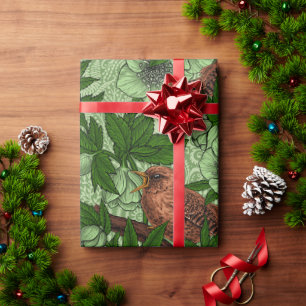 Wren and hellebore on dark green wrapping paper