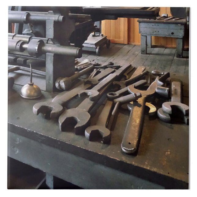 Wrenches and Oil Can in Machine Shop Ceramic Tile (Front)