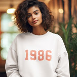 Year Birthday | Custom Coral Pink Modern Trendy Sweatshirt<br><div class="desc">Stylish,  trendy "1986" custom birth year sweatshirt in modern minimalist bold block college style typography in coral pink. The perfect birthday gift to celebrate your year of birth,  establishment and vintage which can be easily personalized with your own year.</div>