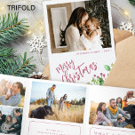 Year in review multi photo red Merry Christmas  Tri-Fold Holiday Card<br><div class="desc">Greenery holly berry foliage modern Merry Christmas red brushed script family year in review 9 photo collage gallery tri fold holiday card with your custom personalised text.</div>
