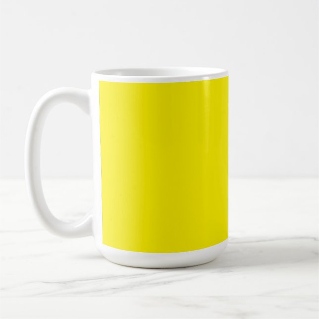 Yellow and orange abstract shapes overlap on a pla coffee mug (Left)