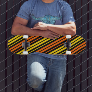 Yellow and Orange Vertical Stripes Black Skateboard