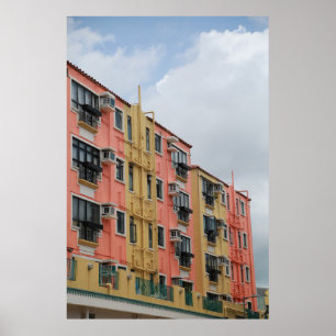 YELLOW AND RED CONCRETE BUILDING UNDER WHITE CLOUD POSTER