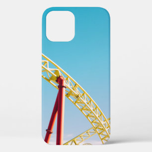 Yellow and red roller coaster under blue sky at da iPhone 12 case
