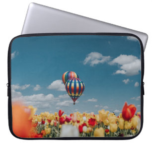Yellow and red tulip flowers under hot air balloon laptop sleeve
