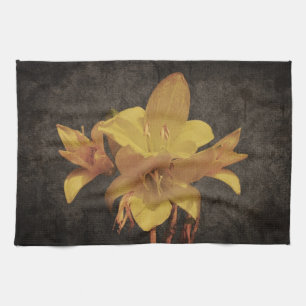 Yellow Asiatic lily on old grunged canvas backgrou Tea Towel