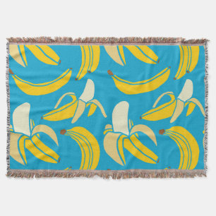 Yellow bananas, blue background pattern throw blanket