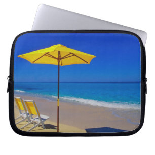 Yellow beach umbrella and chairs on pristine laptop sleeve