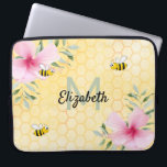 Yellow bees pink flowers name monogrammed laptop sleeve<br><div class="desc">Add some fun and humor to your home office! Yellow, white background with a bee honeycomb pattern and happy smiling bumble bees. Decorated with pink tropical Hibiscus florals , flowers. Template for your name and monogram letter, green and black letters. The name is written with a hand lettered style script....</div>