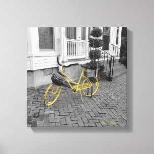 Yellow Bicycle on Cobblestones Canvas Print