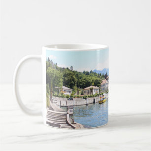 YELLOW BOAT DOCKED NEAR BUILDING COFFEE MUG