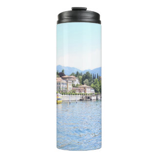 YELLOW BOAT DOCKED NEAR BUILDING THERMAL TUMBLER