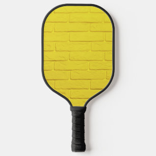 yellow brick wall pickleball paddle