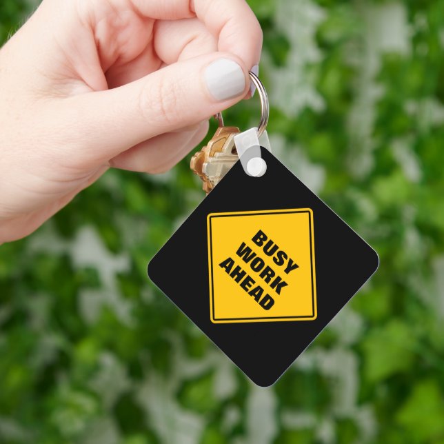 Yellow busy work ahead caution sign personalised key ring (Hand)