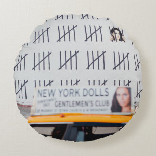 YELLOW CAB IN FRONT OF WHITE PAINTED WALL ROUND CUSHION