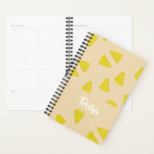 Yellow cheese shapes on pink planner