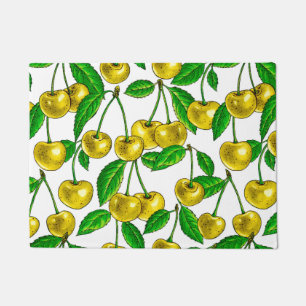 Yellow cherries on white doormat
