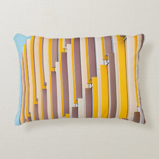 YELLOW CONCRETE BUILDING DURING DAYTIME DECORATIVE CUSHION