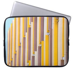 YELLOW CONCRETE BUILDING DURING DAYTIME LAPTOP SLEEVE
