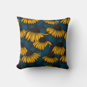 Yellow coneflowers on dark blue cushion