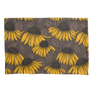 Yellow coneflowers on dark brown pillowcase