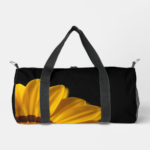 Yellow flower on black background duffle bag