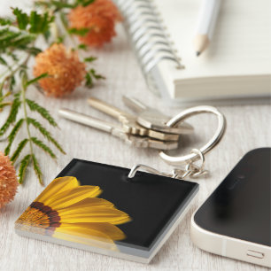 Yellow flower on black background key ring