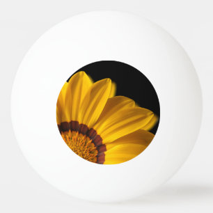 Yellow flower on black background ping pong ball