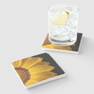 Yellow flower on black background stone coaster
