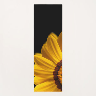 Yellow flower on black background yoga mat