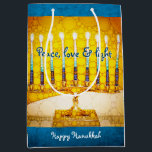 Yellow Gold Hanukkah Menorah Peace Love Light Bold Medium Gift Bag<br><div class="desc">“Peace, love & light.” A close-up photo illustration of a bright, colourful, yellow and gold artsy menorah helps you usher in the holiday of Hanukkah in style. Feel the warmth and joy of the holiday season whenever you use this cute and fun personalised medium size gift bag. Matching cards, postage,...</div>