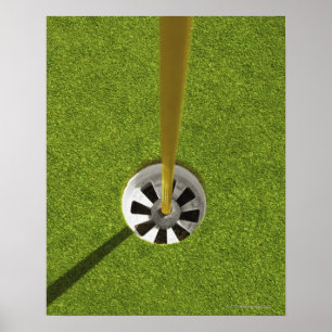 Yellow golf flag pole and hole poster