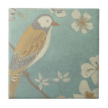 Yellow, Grey and Beige Bird Perched on a Branch Tile<br><div class="desc">Chariklia Zarris is known for her abstract art pieces. In this drawing of a profile of a bird on a blue teal background, she captured the simplicity of the bird. The white flowers add a romantic touch. Customise your favourite Zazzle product using this beautiful image.</div>