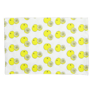 Yellow lemon fruits on white pillowcase