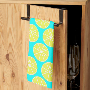 Yellow Lemon slised on blue background Tea Towel